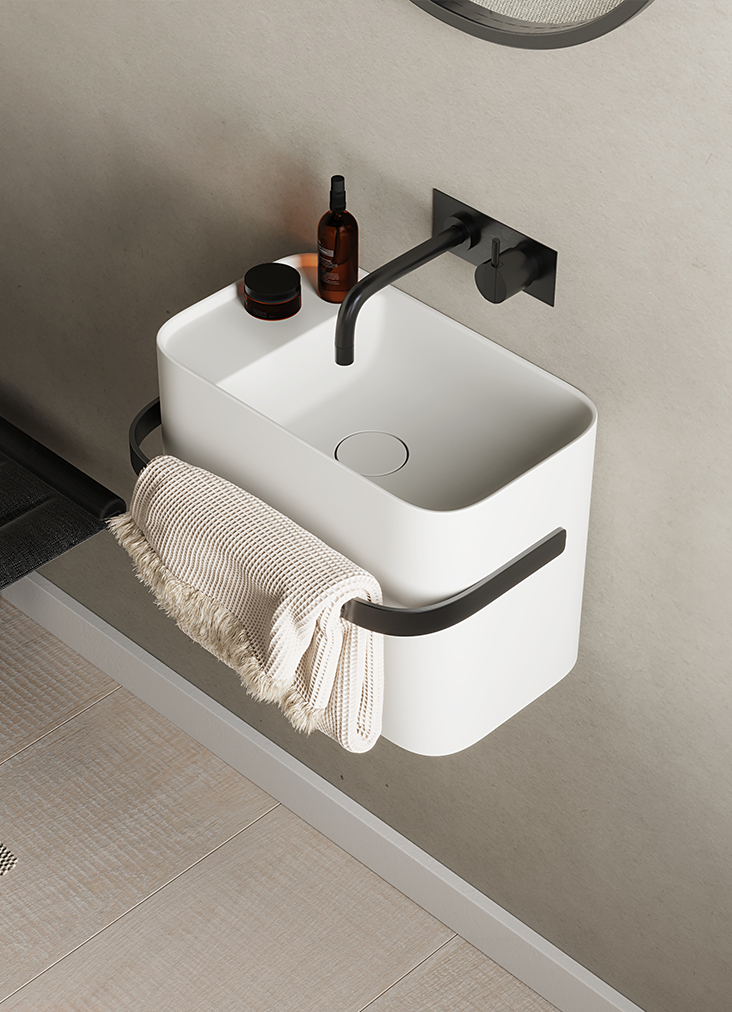 Alt text: The Yuno Rail Wash Basin from Copenhagen Bath, featuring Copenhagen minimalism with sleek lines and a practical towel rail in gun black metal or PVD gold.